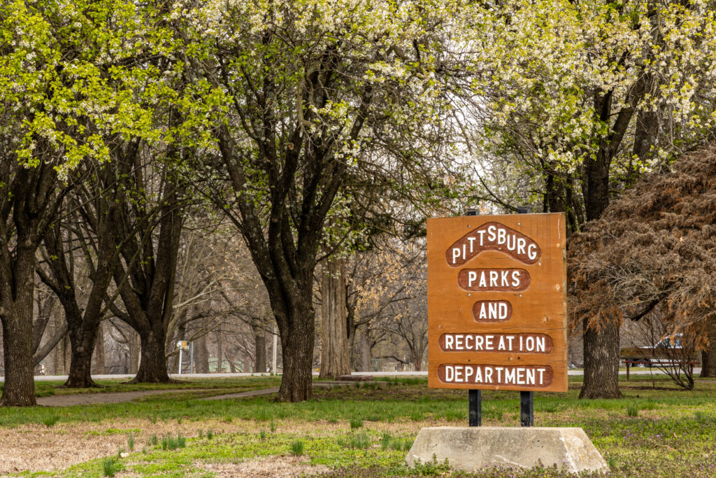 Lincoln Park Sign surrounded by trees in spring
