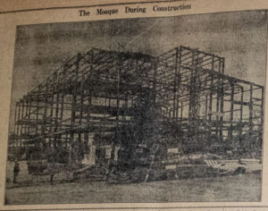 A newspaper image of a building being built