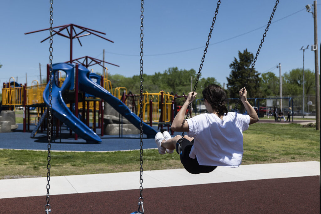 Someone swinging on the swing at Schlanger Park in Pittsburg, KS.