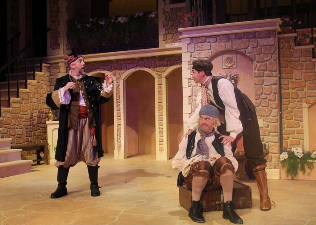 Actors on stage performing Twelfth Night.